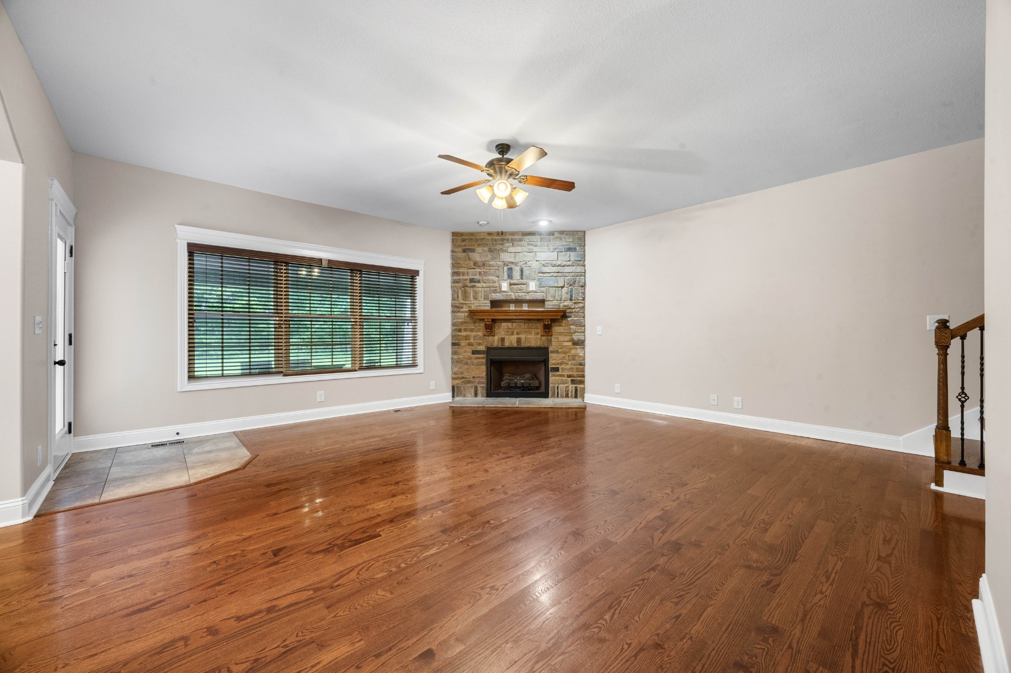 1789 Double R Boulevard Clarksville, TN 37042 - Photo 17 of 53 a view of an empty room with a window and wooden floor