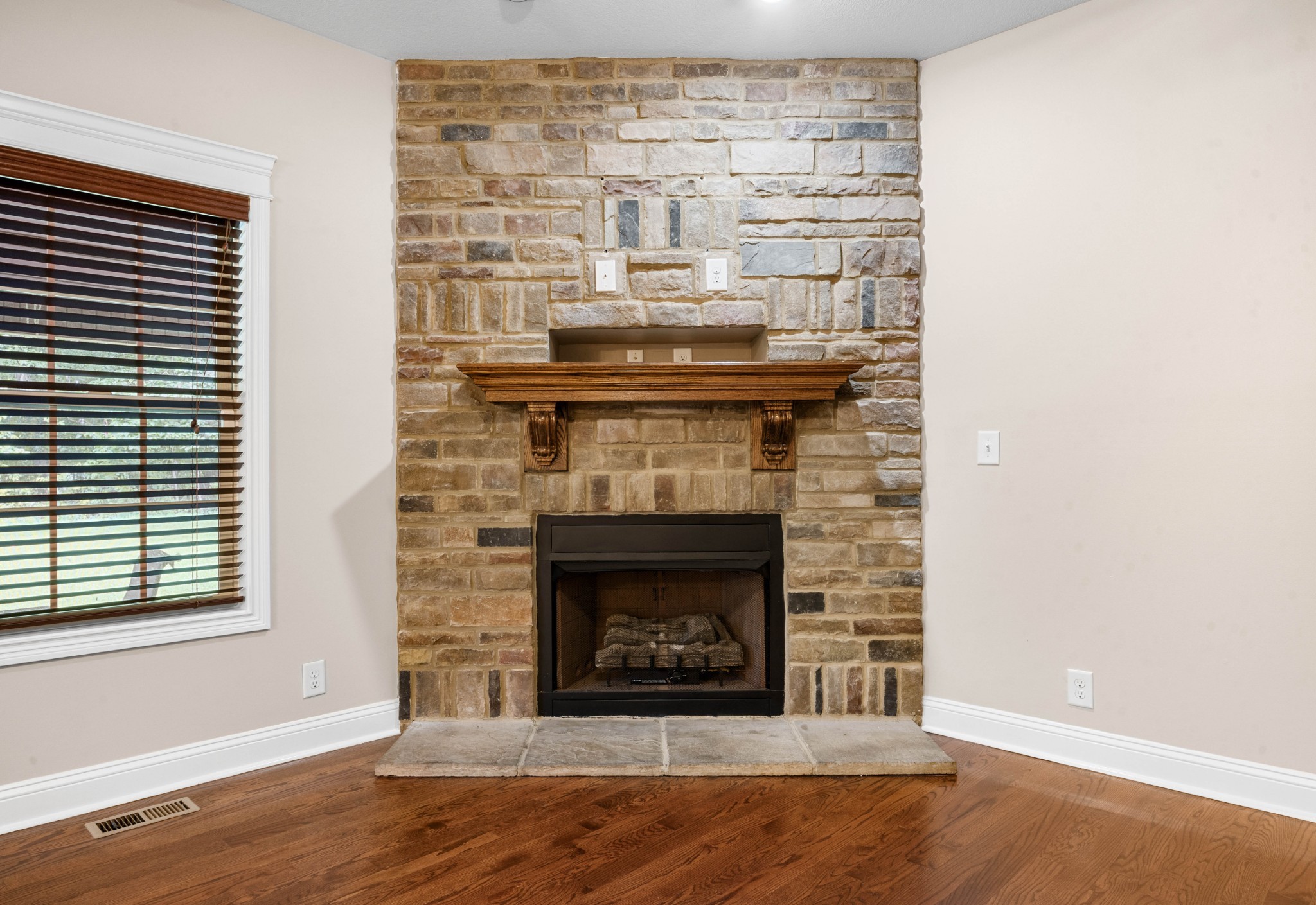 1789 Double R Boulevard Clarksville, TN 37042 - Photo 20 of 53 a living room with a fireplace and a wooden floor
