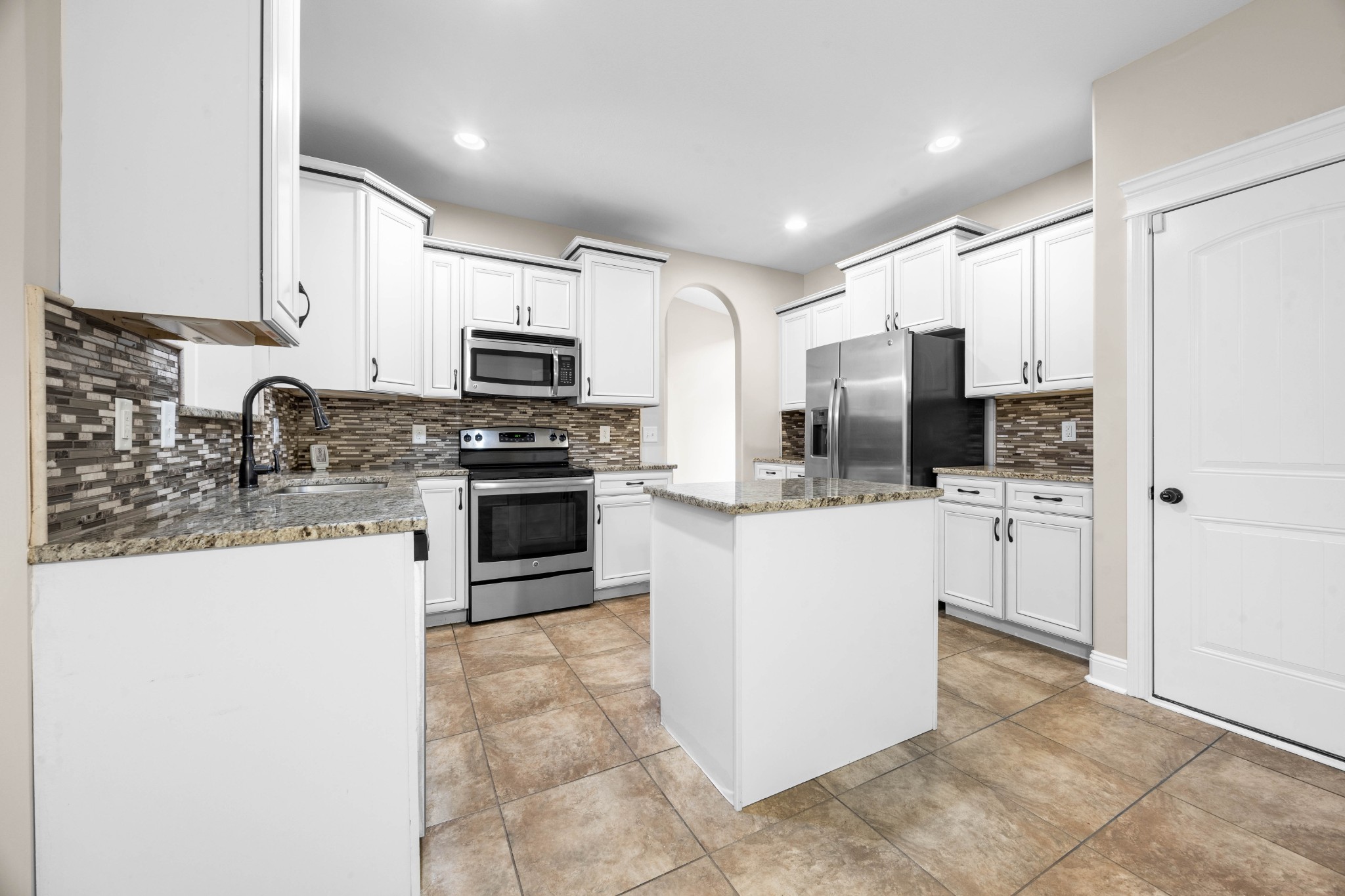 1789 Double R Boulevard Clarksville, TN 37042 - Photo 24 of 53 a kitchen with stainless steel appliances and white cabinets