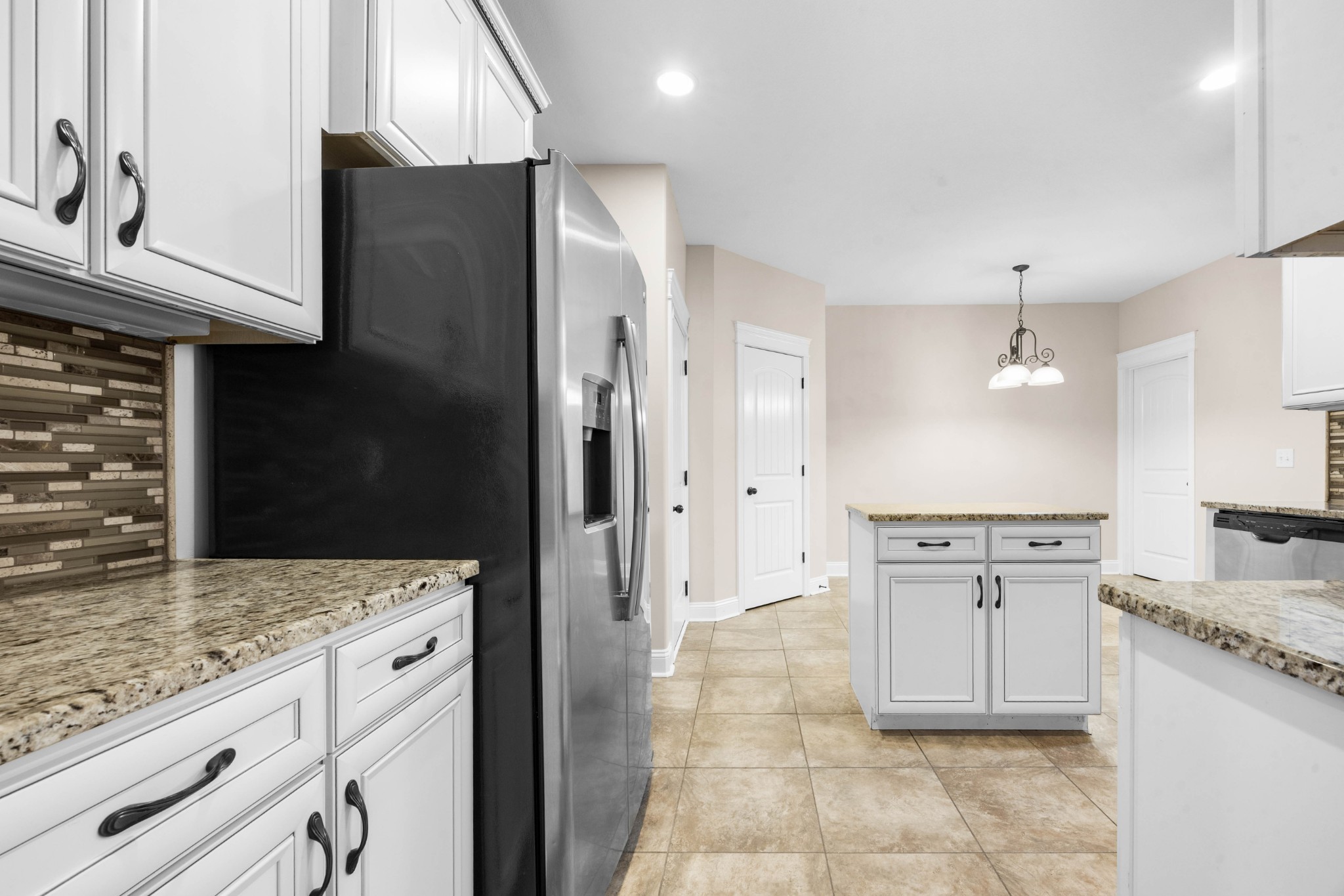1789 Double R Boulevard Clarksville, TN 37042 - Photo 25 of 53 a kitchen with stainless steel appliances granite countertop a refrigerator and a stove