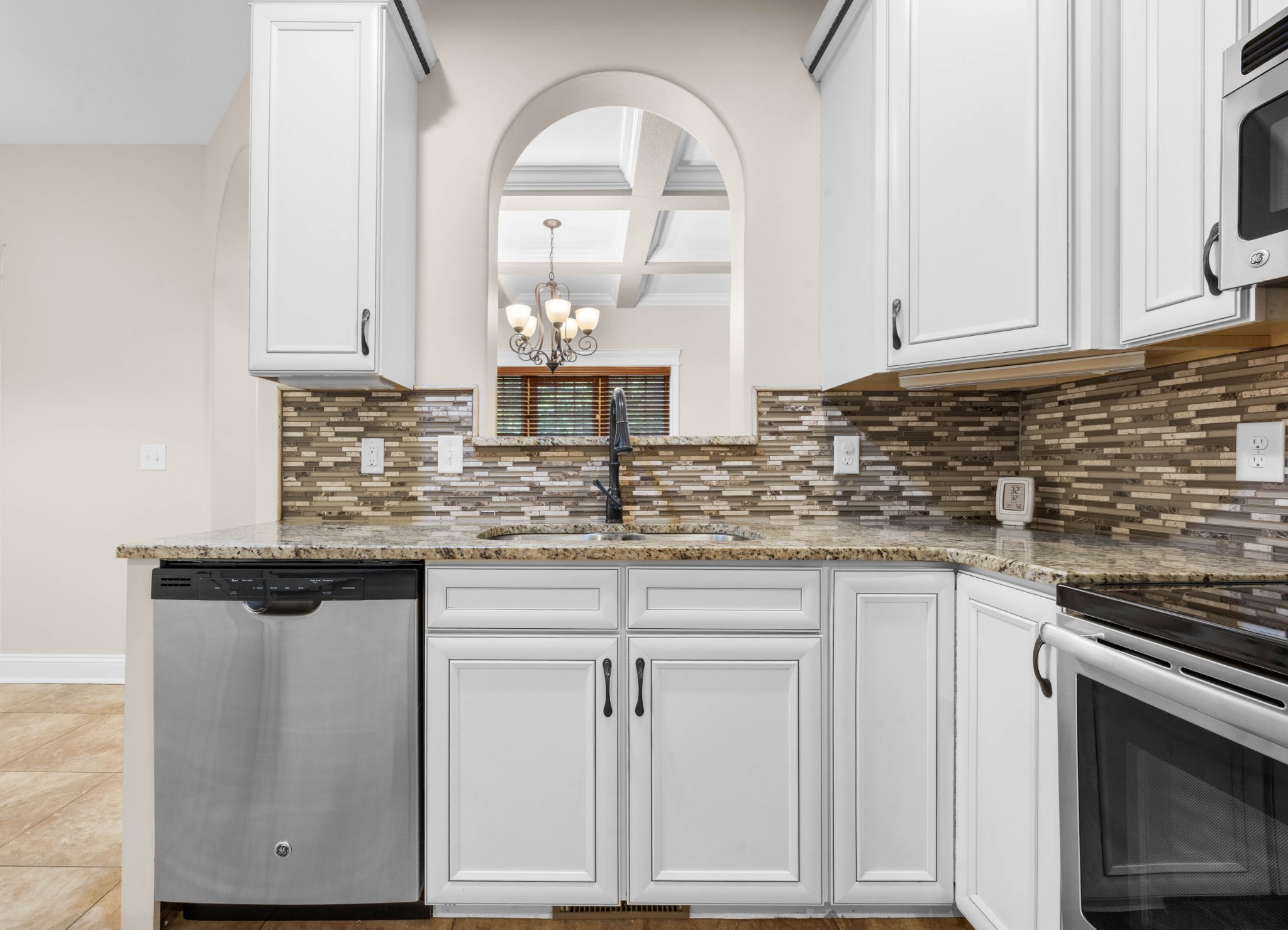1789 Double R Boulevard Clarksville, TN 37042 - Photo 26 of 53 a kitchen with granite countertop white cabinets and white appliances