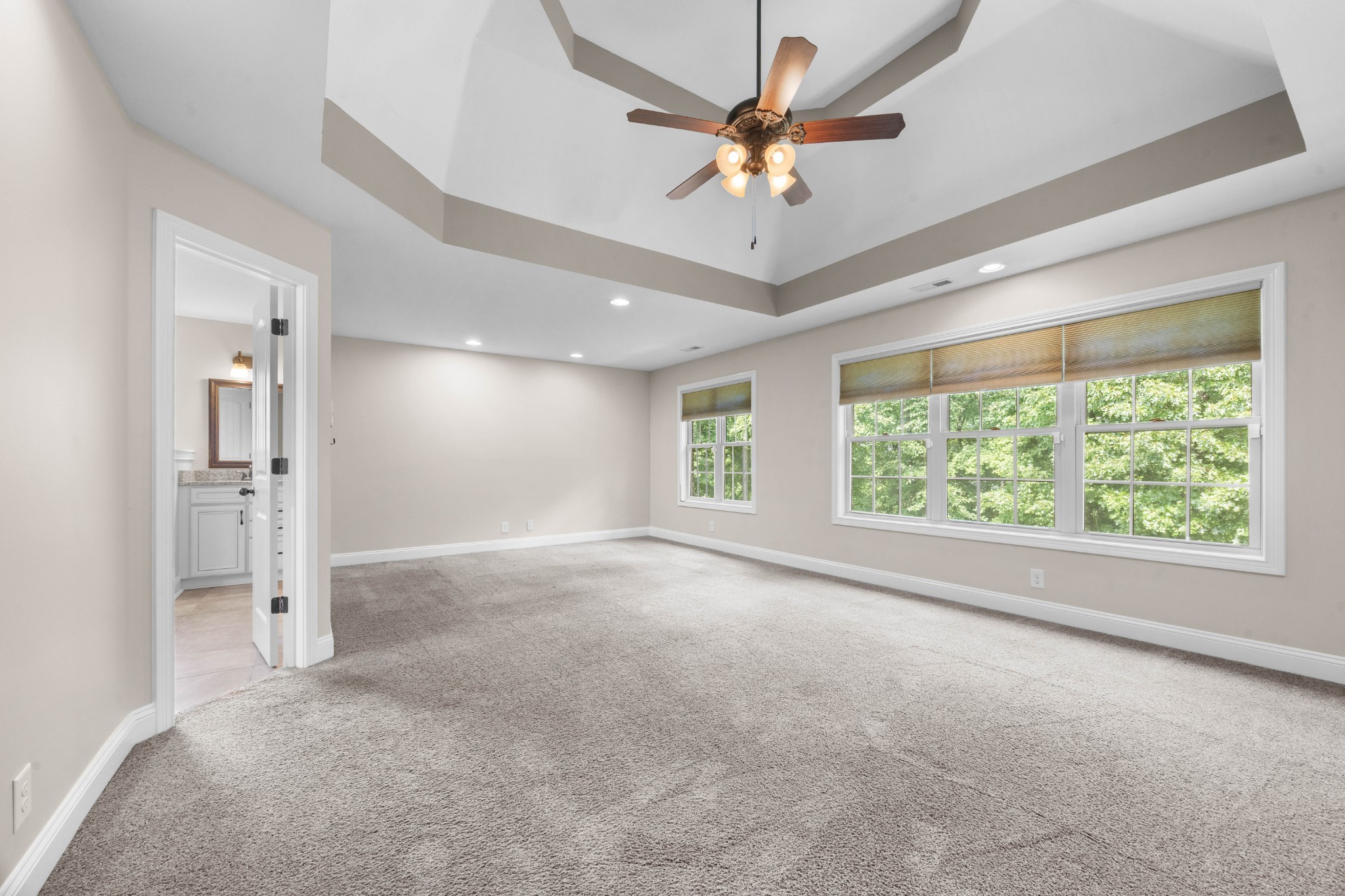 1789 Double R Boulevard Clarksville, TN 37042 - Photo 31 of 53 an empty room with windows and ceiling fan