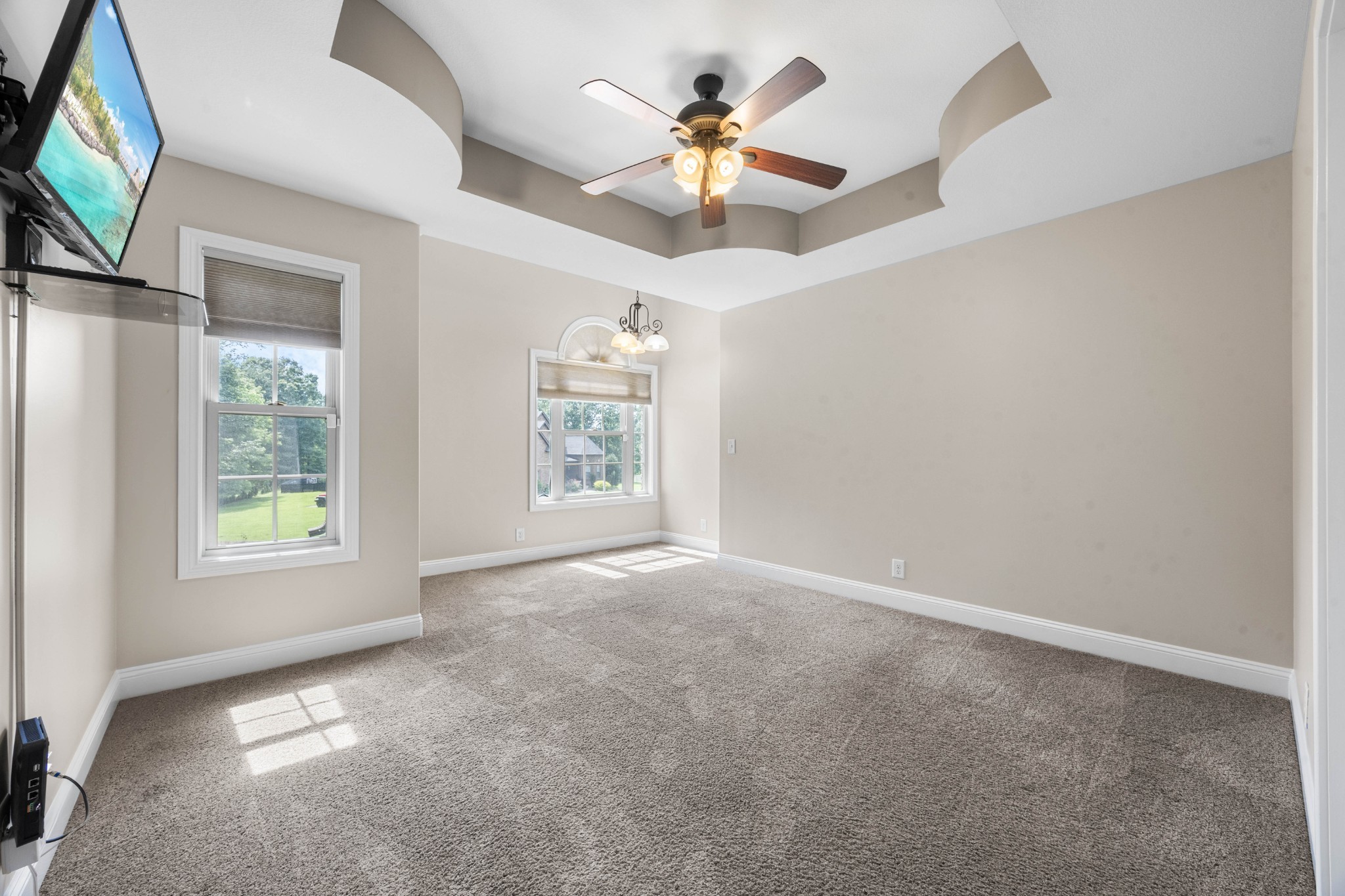 1789 Double R Boulevard Clarksville, TN 37042 - Photo 41 of 53 an empty room with windows and a ceiling fan