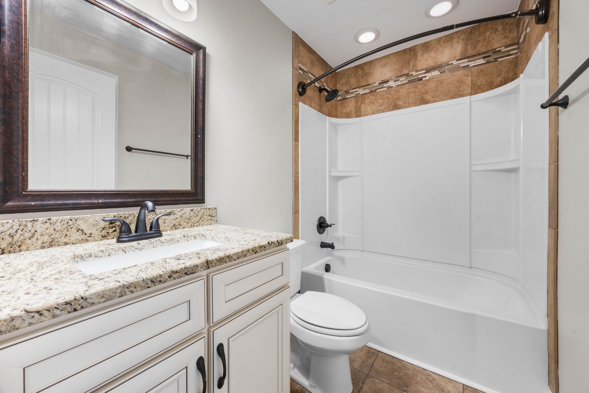 1789 Double R Boulevard Clarksville, TN 37042 - Photo 46 of 53 a bathroom with a granite countertop sink a toilet and shower