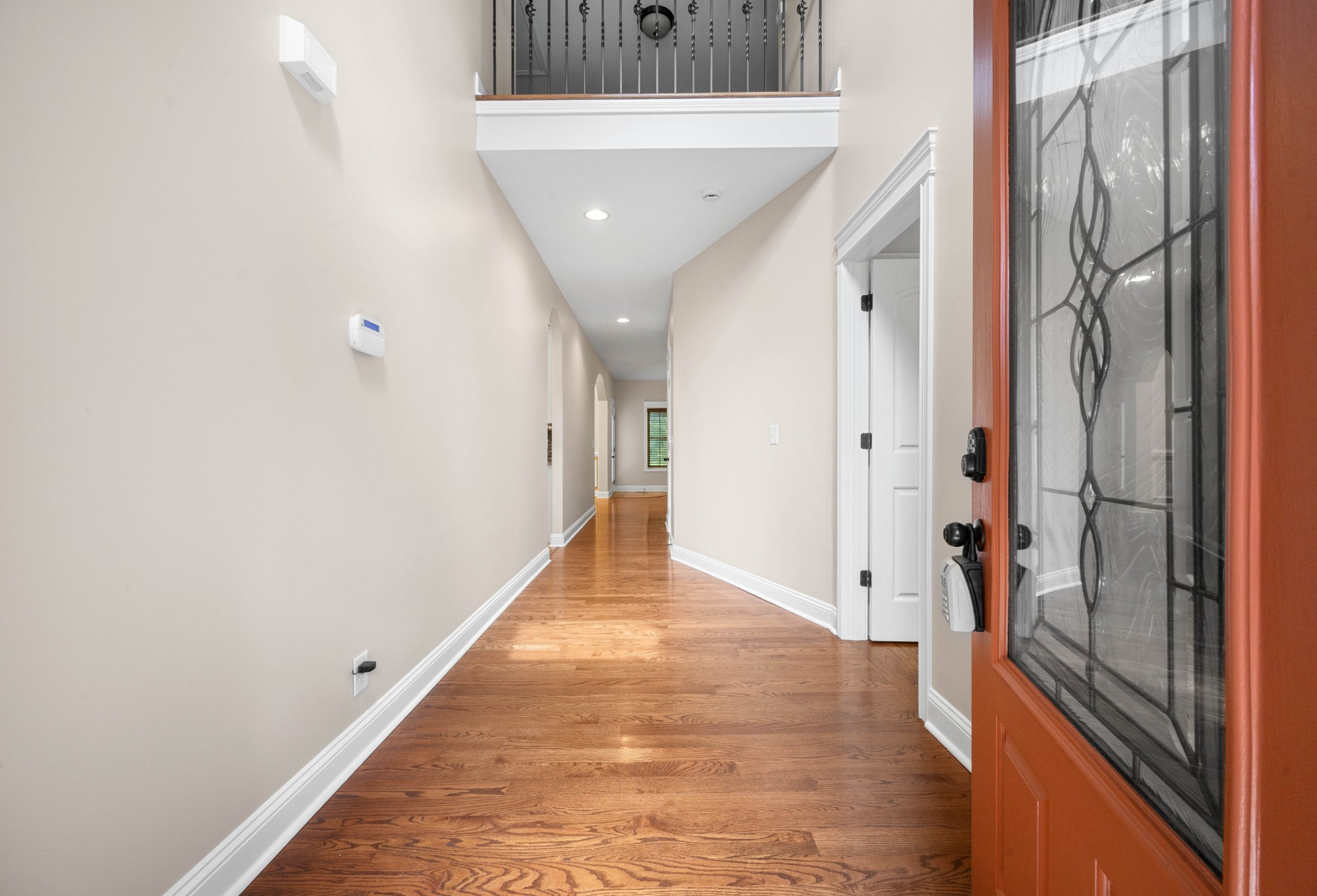 1789 Double R Boulevard Clarksville, TN 37042 - Photo 9 of 53 a view of a hallway with wooden floor and staircase