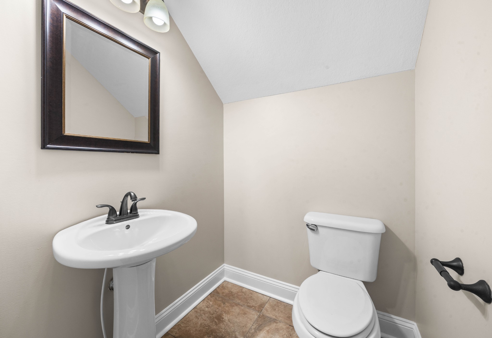 1789 Double R Boulevard Clarksville, TN 37042 - Photo 10 of 53 a bathroom with a toilet sink and mirror