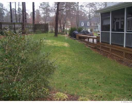 7909 Sutterton Court Raleigh, NC 27615 - Photo 12 of 12 Private, well-landscaped, wooded backyard Exterior Back