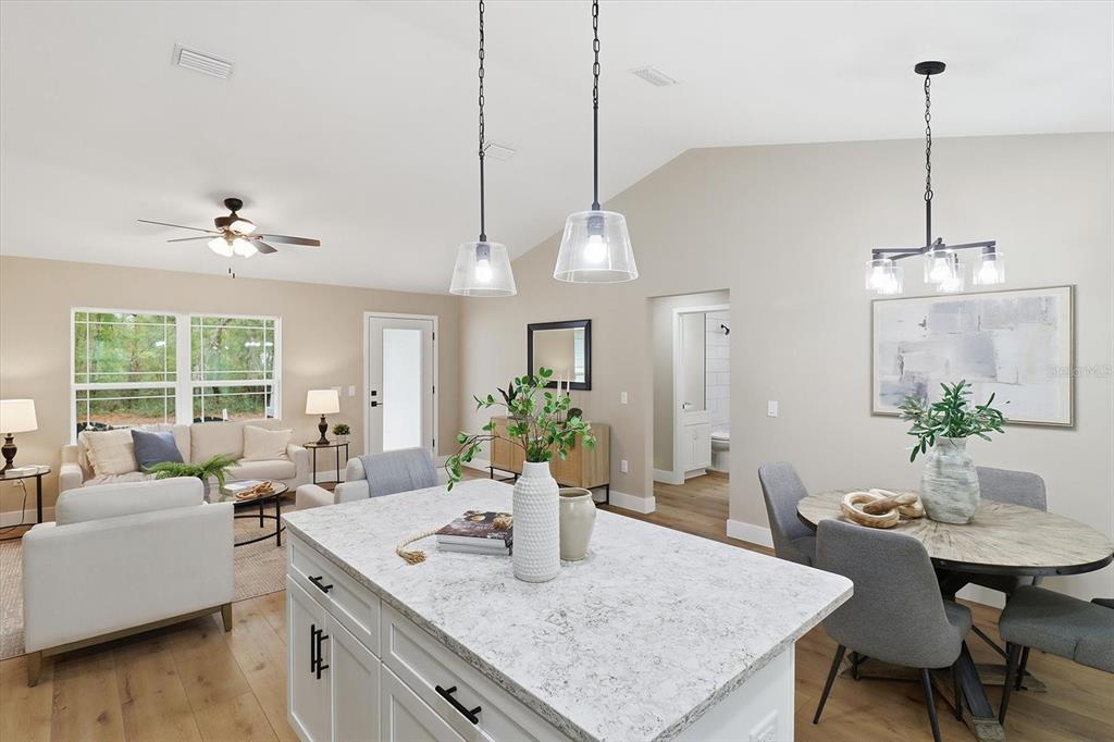 3671 East Ryan Street Inverness, FL 34453 - Photo 16 of 48 a view of a dining room furniture and wooden floor