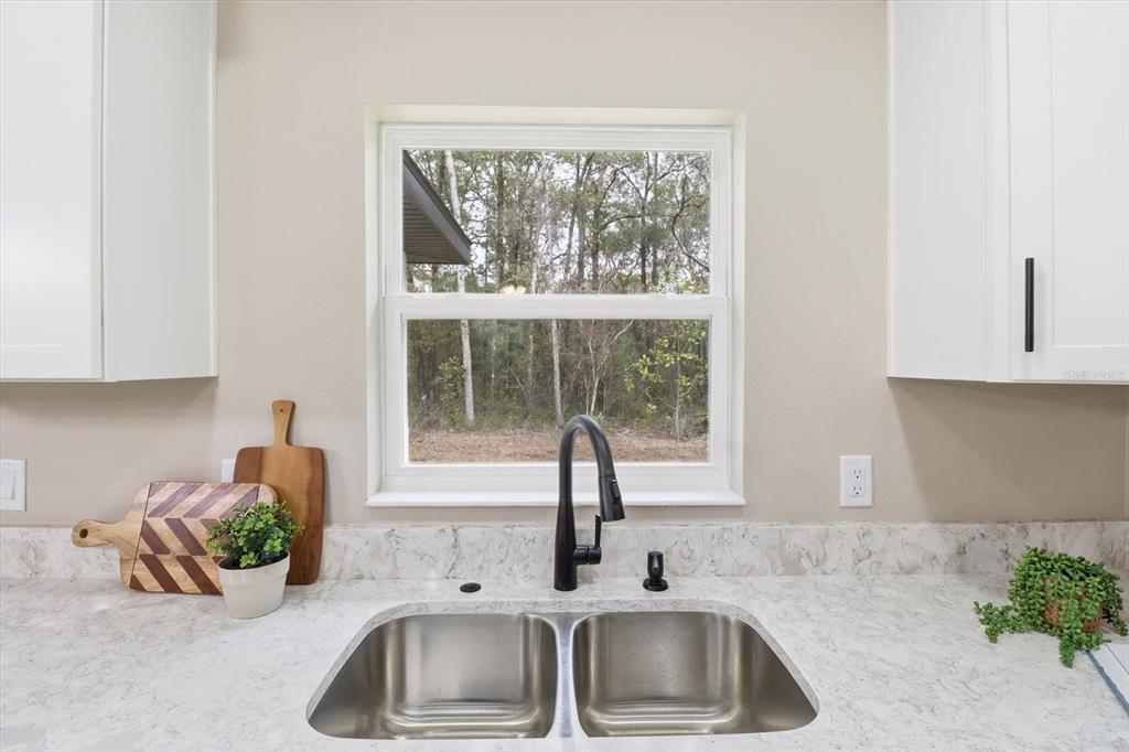3671 East Ryan Street Inverness, FL 34453 - Photo 18 of 48 a kitchen with a sink and a window
