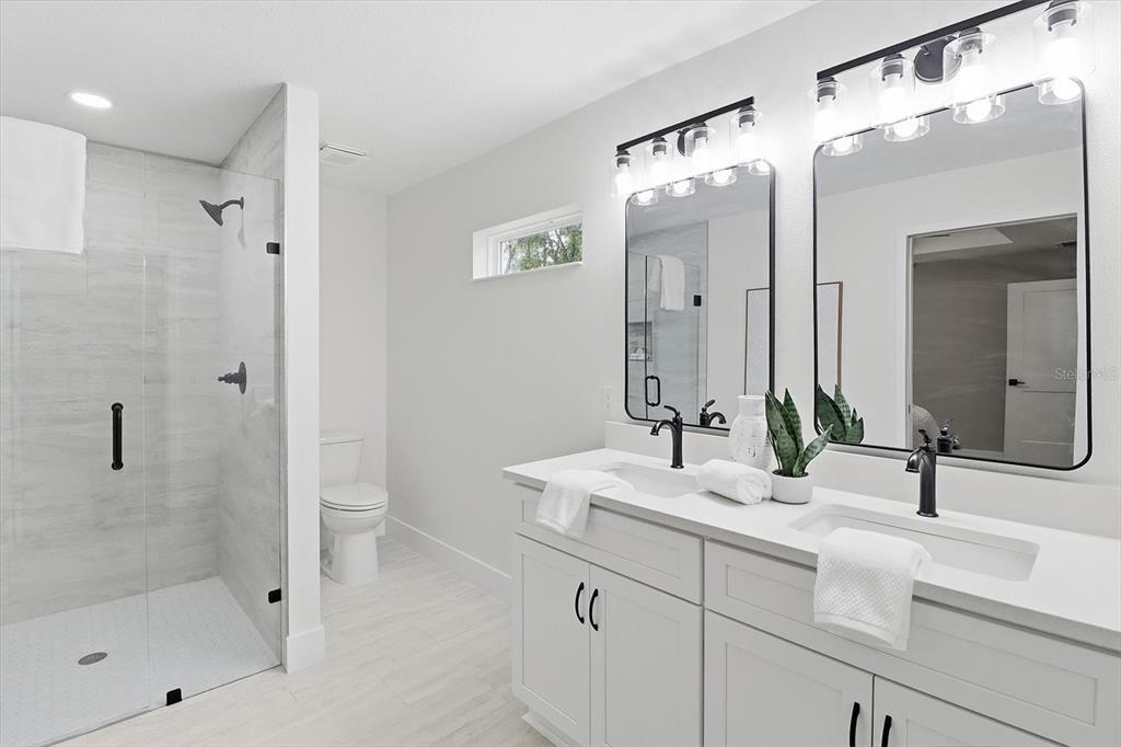 3671 East Ryan Street Inverness, FL 34453 - Photo 22 of 48 a bathroom with a sink a toilet and shower