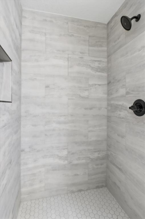 3671 East Ryan Street Inverness, FL 34453 - Photo 24 of 48 a bathroom with a shower