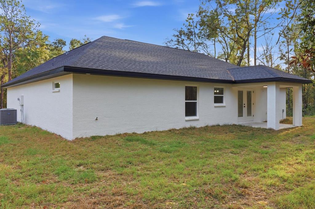 3671 East Ryan Street Inverness, FL 34453 - Photo 38 of 48 a house with garden in front of it