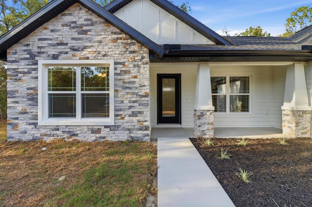 3671 East Ryan Street Inverness, FL 34453 - Photo 4 of 48 a front view of a house with a yard