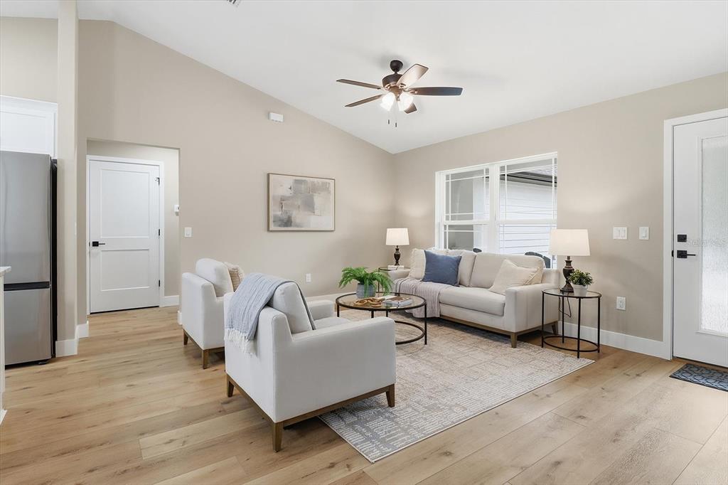 3671 East Ryan Street Inverness, FL 34453 - Photo 9 of 48 a living room with furniture and a chandelier