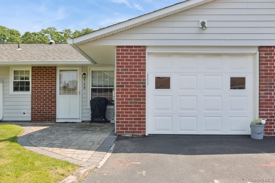 96 Enfield Court, Unit B Ridge, NY 11961 - Photo 3 of 22 a view of a house with a garage