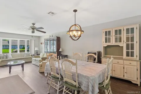 a very nice looking dining room with a table and chairs