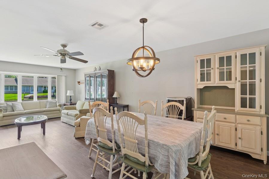96 Enfield Court, Unit B Ridge, NY 11961 - Photo 9 of 22 a very nice looking dining room with a table and chairs