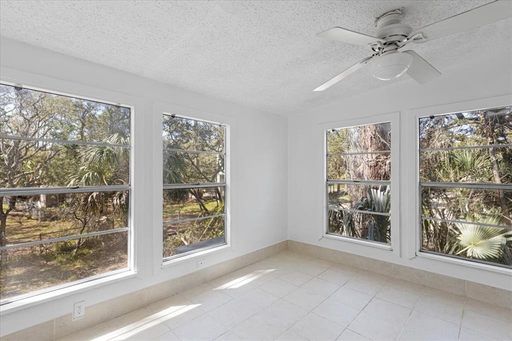 1149 Shell Crest Avenue Cedar Key, FL 32625 - Photo 16 of 32 a view of an empty room with a window