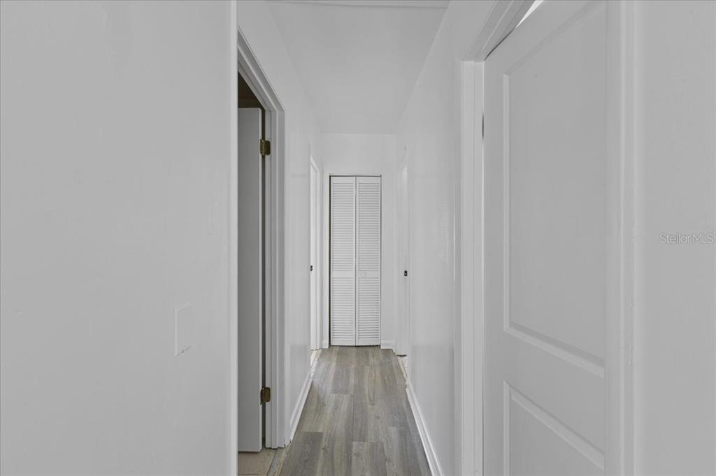 1149 Shell Crest Avenue Cedar Key, FL 32625 - Photo 21 of 32 a view of a hallway with wooden floor