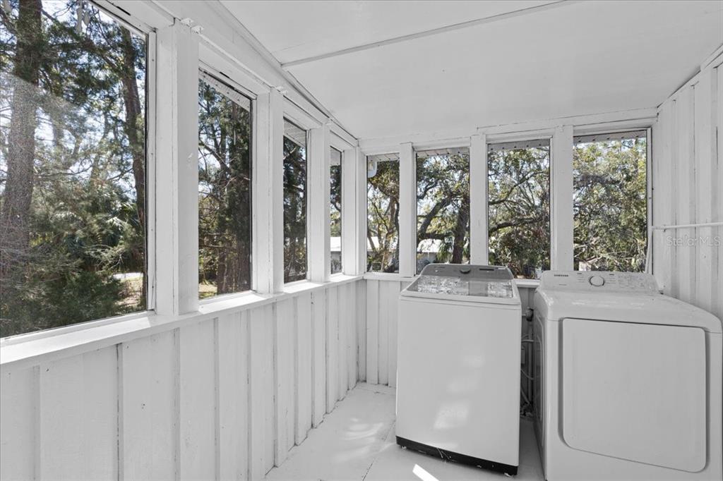 1149 Shell Crest Avenue Cedar Key, FL 32625 - Photo 27 of 32 a view of a kitchen with a large window