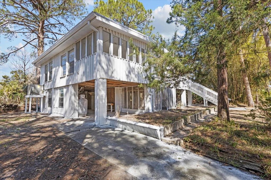 1149 Shell Crest Avenue Cedar Key, FL 32625 - Photo 3 of 32 a view of a house with a yard