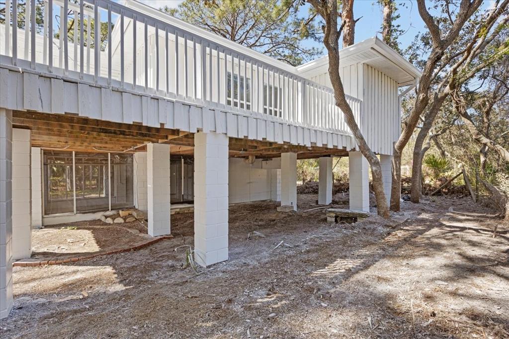 1149 Shell Crest Avenue Cedar Key, FL 32625 - Photo 8 of 32 a view of a house with a large tree front of house