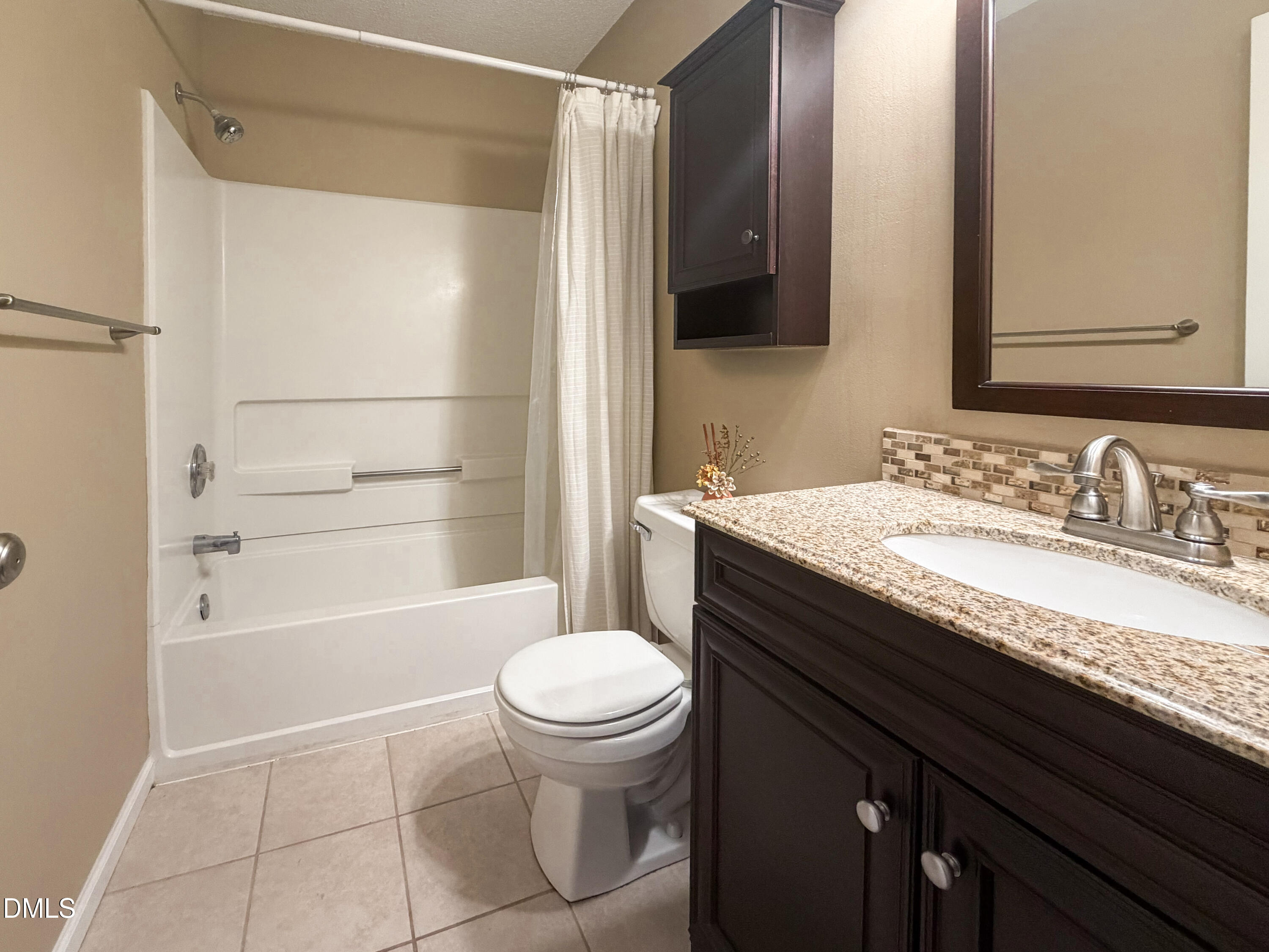 6304 Forest Ridge Drive Durham, NC 27713 - Photo 15 of 29 a bathroom with a granite countertop sink toilet and shower