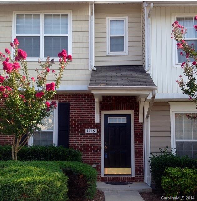 1115 Sienna Sand Way, Unit 111 Fort Mill, SC 29708 - Photo 1 of 15 a view of front door and potted plants