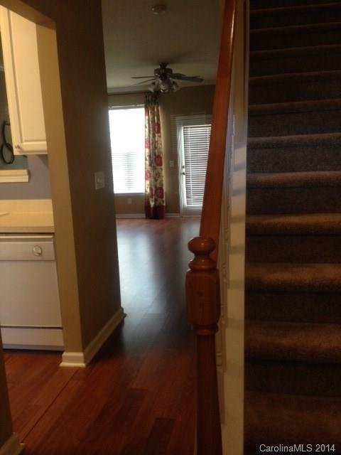 1115 Sienna Sand Way, Unit 111 Fort Mill, SC 29708 - Photo 2 of 15 a view of a hallway with a chair and a window