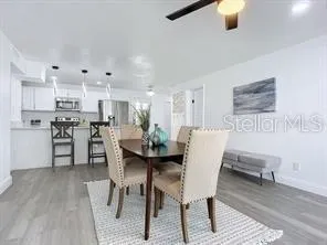 a dining room with furniture and window