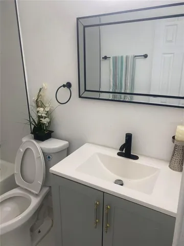 a bathroom with a sink and a toilet