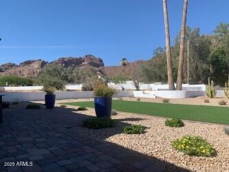 4632 North 49th Place Phoenix, AZ 85018 - Photo 3 of 13 a view of a garden with a building in the background