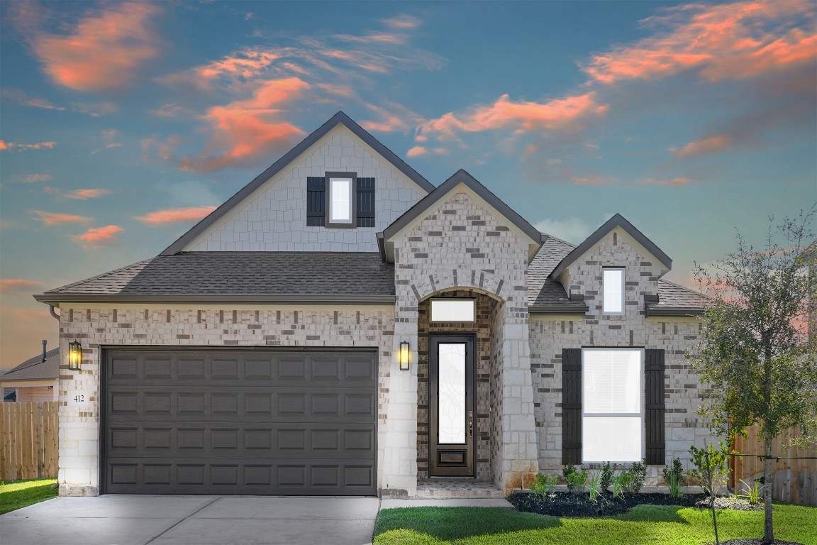 412 Elmbrook Terrace Way Waller, TX 77484 - Photo 1 of 38 a front view of a house with garden