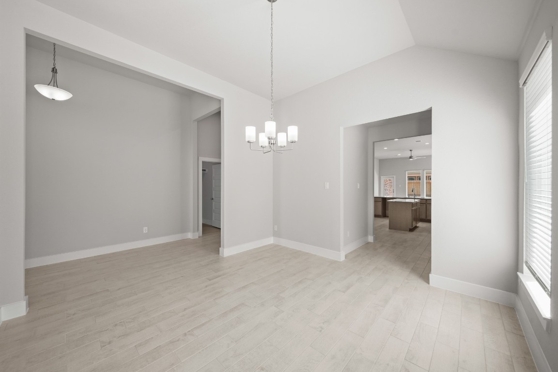 412 Elmbrook Terrace Way Waller, TX 77484 - Photo 11 of 38 a view of a chandelier in big room and a bathroom