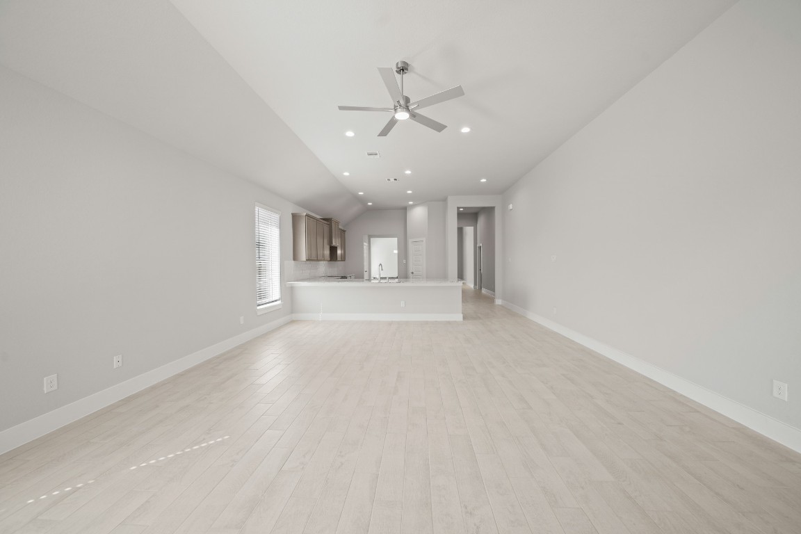 412 Elmbrook Terrace Way Waller, TX 77484 - Photo 12 of 38 a view of a livingroom with a ceiling fan & window