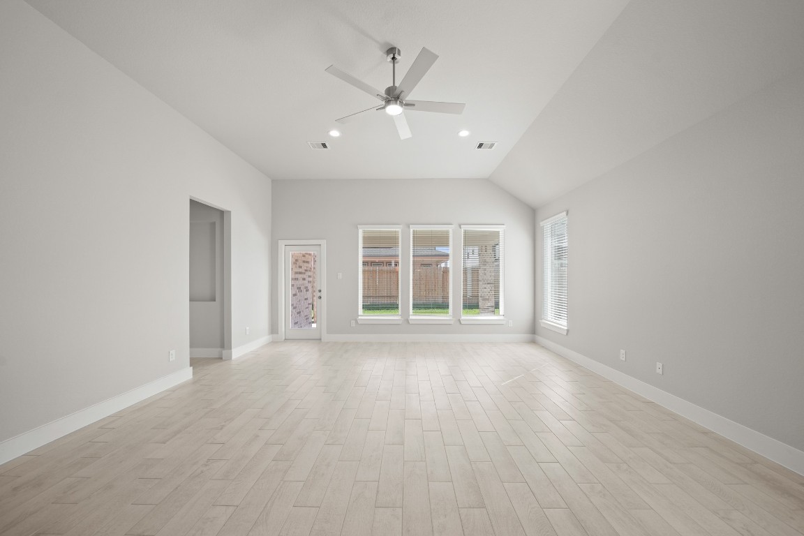 412 Elmbrook Terrace Way Waller, TX 77484 - Photo 13 of 38 wooden floor in an empty room with a window