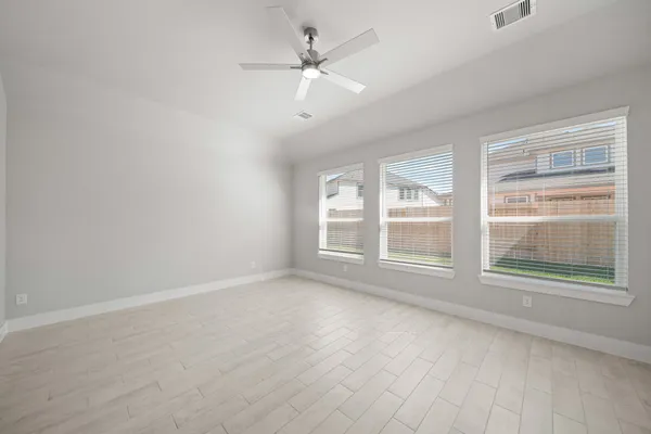 a view of an empty room with a window