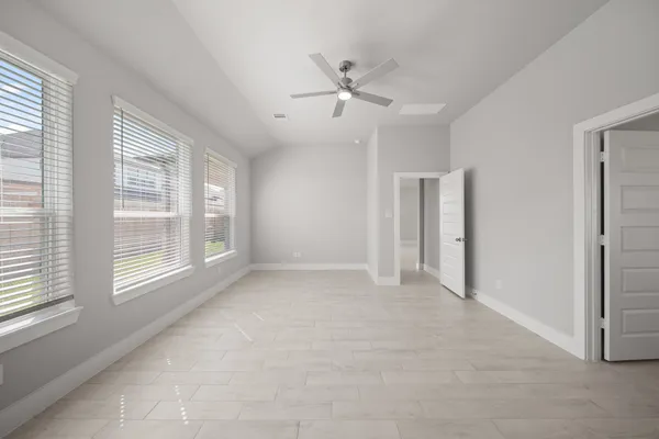 a view of an empty room with a window