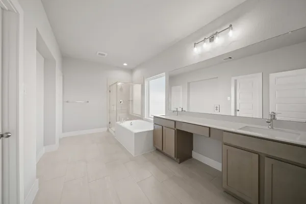 a large white kitchen with a sink and dishwasher