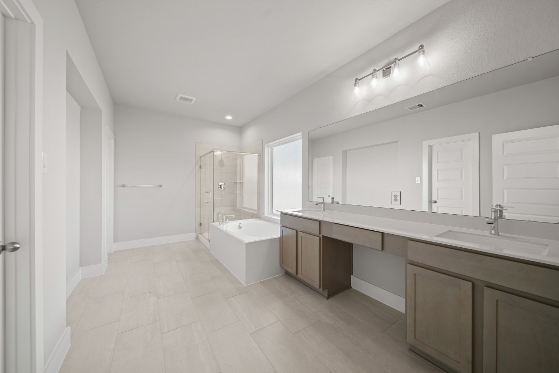 412 Elmbrook Terrace Way Waller, TX 77484 - Photo 17 of 38 a large white kitchen with a sink and dishwasher