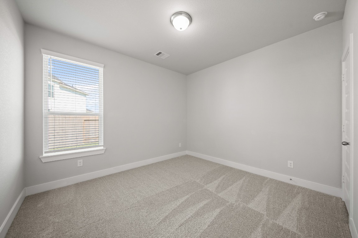 412 Elmbrook Terrace Way Waller, TX 77484 - Photo 20 of 38 an empty room with a window