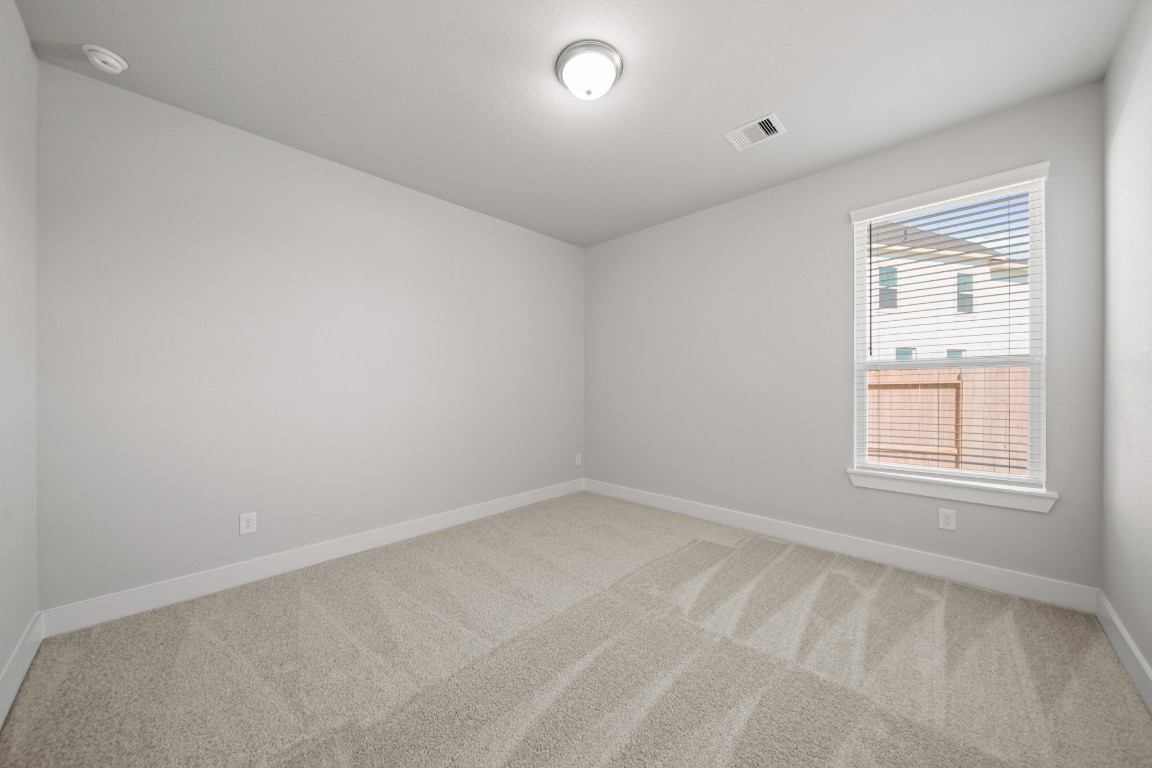 412 Elmbrook Terrace Way Waller, TX 77484 - Photo 21 of 38 an empty room with a window