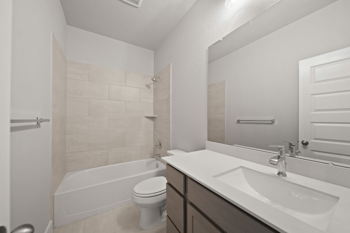 412 Elmbrook Terrace Way Waller, TX 77484 - Photo 22 of 38 a bathroom with a sink a toilet and bathtub
