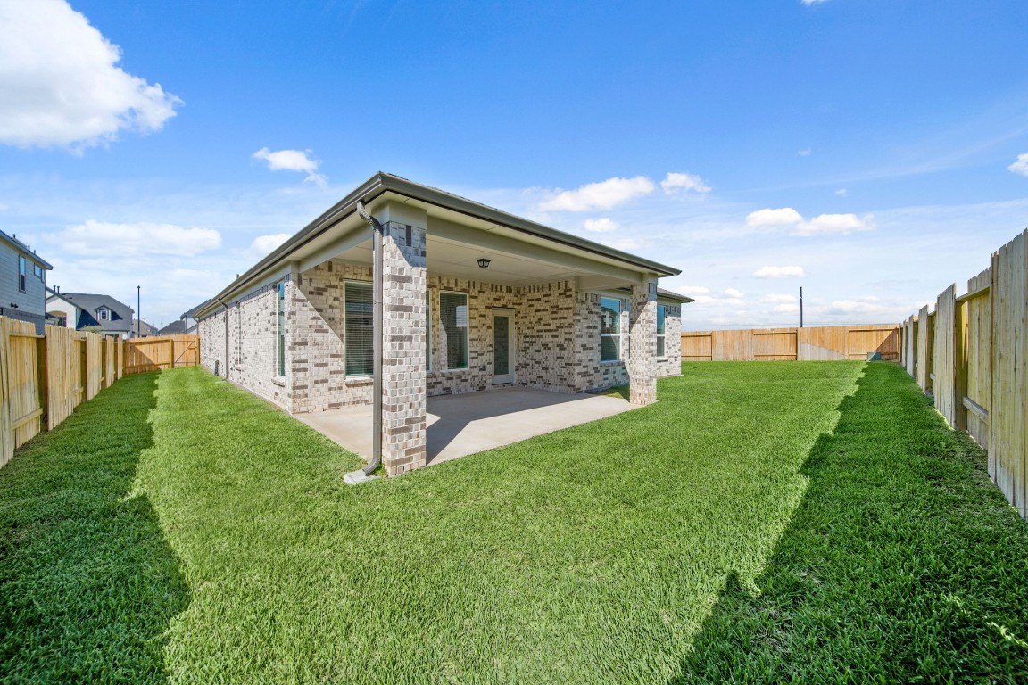 412 Elmbrook Terrace Way Waller, TX 77484 - Photo 25 of 38 a view of a house with backyard and garden