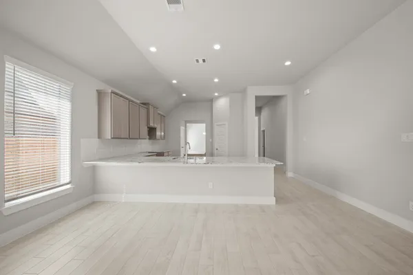 a view of kitchen with wooden floor and window