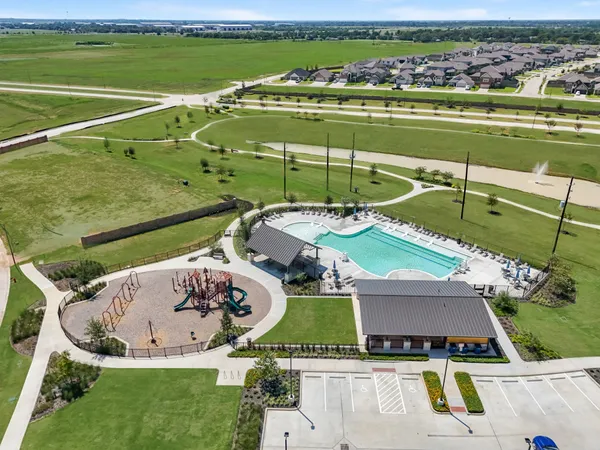 an aerial view of a house with a swimming pool