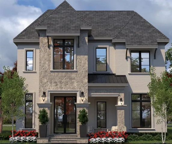 a front view of a house with plants