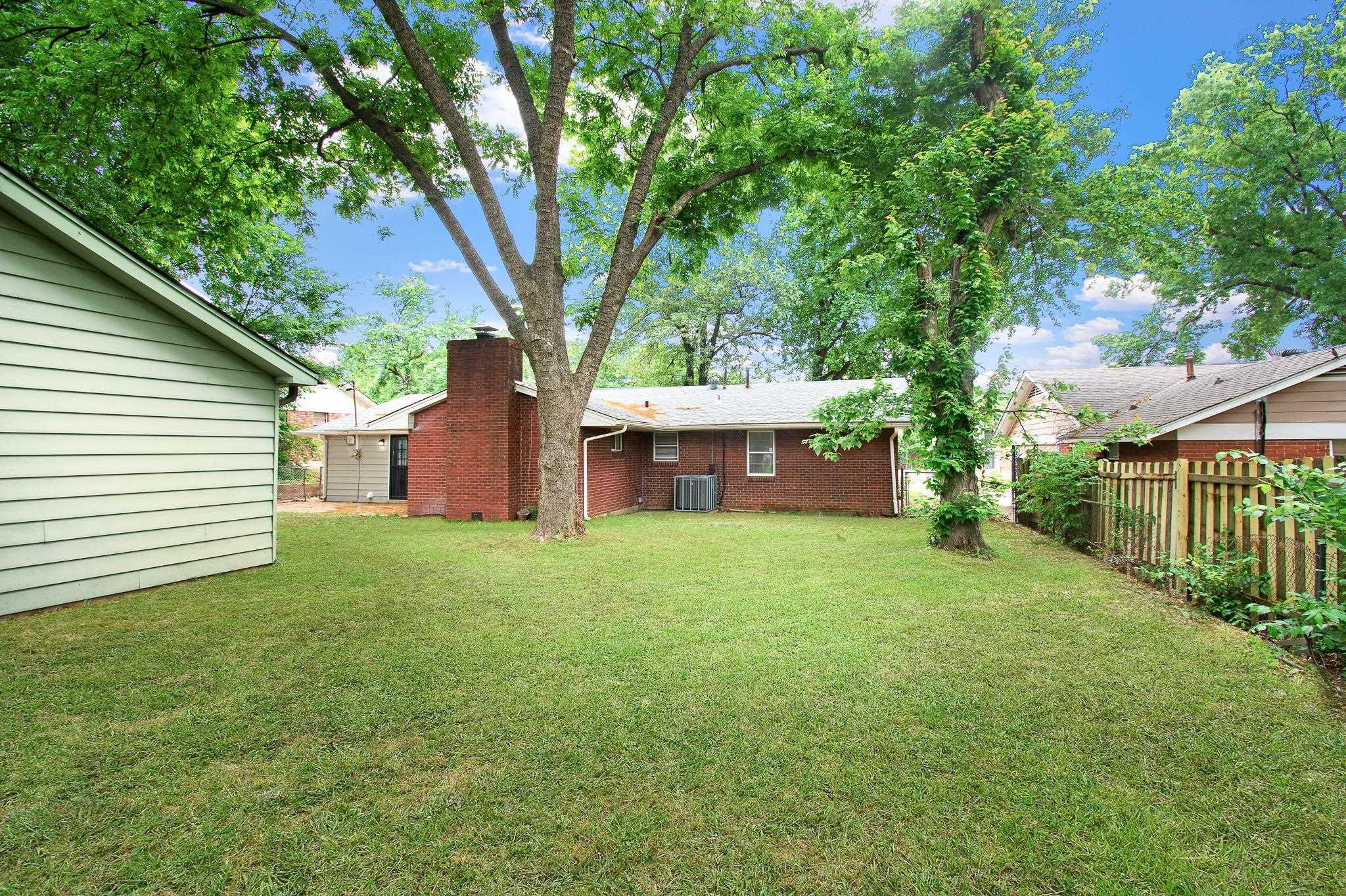 3839 Millbranch Road Memphis, TN 38116 - Photo 3 of 18 a view of a house with backyard and garden