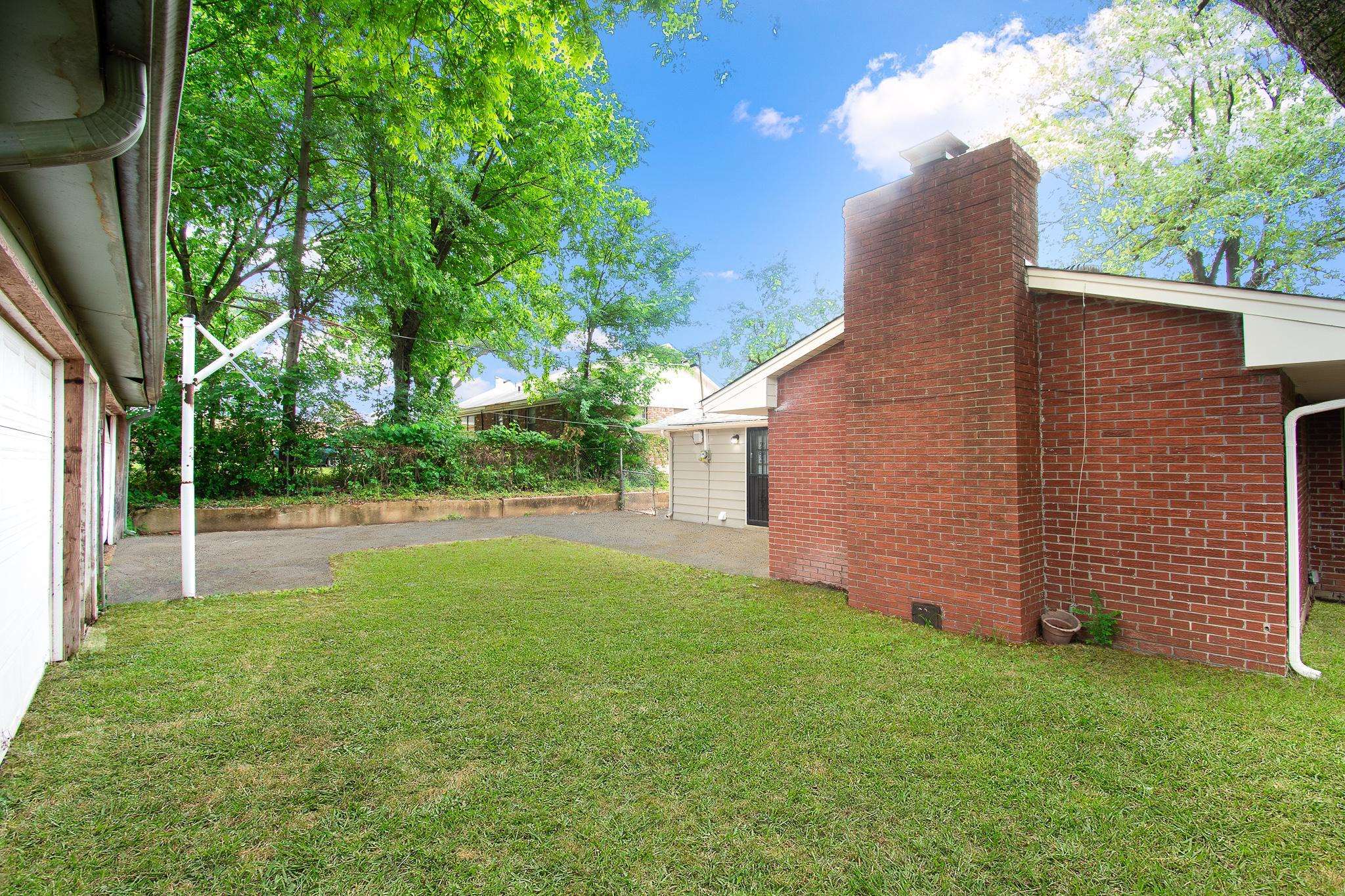 3839 Millbranch Road Memphis, TN 38116 - Photo 4 of 18 a view of backyard with swimming pool