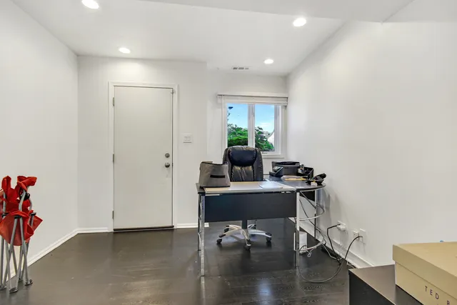 a workspace with furniture and wooden floor